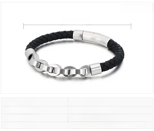 Macro shot of men's leather braided bracelet with brushed stainless steel magnetic clasp