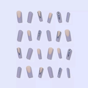 French press-on nails in light purple with glitter rhinestones and a square oval shape