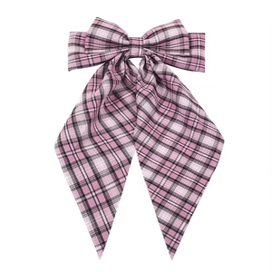 Pink plaid oversized bow hair clip with ribbons for women in classic preppy style