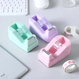 Three macaron colored desktop tape dispensers in mint green, purple, and pink ABS plastic