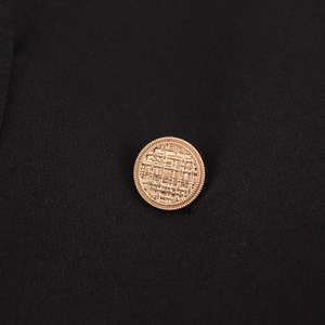 Women's black double-breasted coat featuring classic gold woven metal buttons details