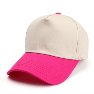 Detail view of two-tone five-panel baseball cap with beige crown and rose red visor