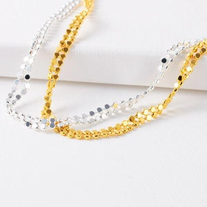 Collana a doppio strato con dischi dorati e argentati, design choker minimalista da donna