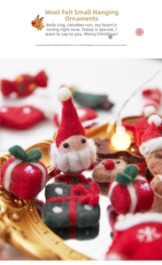 Close-up of handmade wool felt Santa and gift box hanging Christmas ornaments