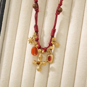 Ethnic red cord necklace with gold cross, red gemstone pendant and tiger eye beads