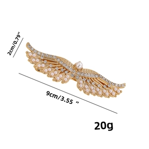 Detailed view of rhinestone butterfly wing clip with pearls measuring 9cm in length