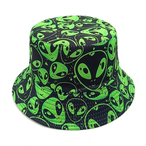 Detail shot of black bucket hat with vibrant green alien prints and durable cotton fabric