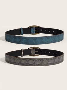 Detail of vintage Y2K belts with embossed patterns and bronze buckles in blue and grey