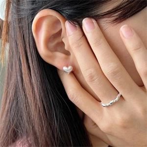 Minimalist 925 sterling silver heart earrings and twisted rope ring on model