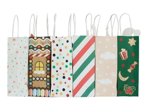 Six festive Christmas kraft paper gift bags with colorful patterns and white rope handles