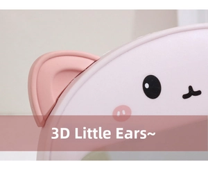 Detail shot of cute 3D cartoon bear ears on a pink folding desktop makeup mirror