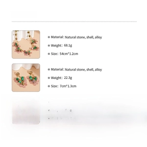 Detail view of pink shell and green stone necklace set with weight and size specifications