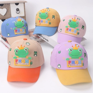 Detail of colorful children baseball caps with 3D cartoon frog and crown decoration