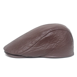 Close-up of dark brown faux leather flat cap showing stitching and retro texture