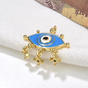 Vintage gold Turkish evil eye necklace with blue enamel and cross tassel charms