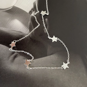Minimalist 925 sterling silver star necklace featuring polished pentagram pendants