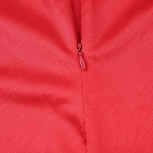 Detail view of high-quality invisible red zipper on satin fabric with precise stitching