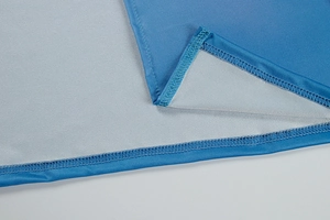 Detail shot of the reinforced blue fabric hem and high-quality stitching on dress