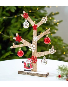 Close-up of wooden Christmas tree ornament with Santa Claus figure and colorful bells