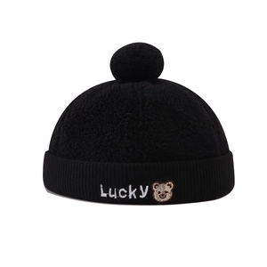 Black fleece docker hat for kids featuring lucky bear embroidery and a soft plush pompom