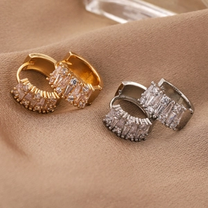 Fashionable zircon hoop earrings in gold and silver finish with pavé set crystals