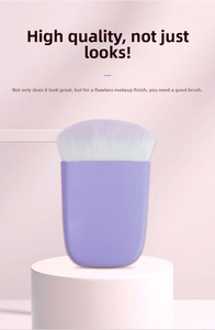 Detailed close-up of a flat blush brush with purple and white gradient bristles