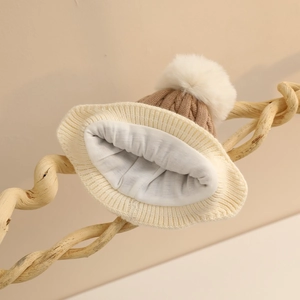 Winter infant knit hat with pompom featuring color-block cable knit and ear flaps