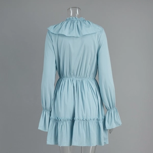 Back view of light blue V-neck dress with ruffle collar and elastic waist detail