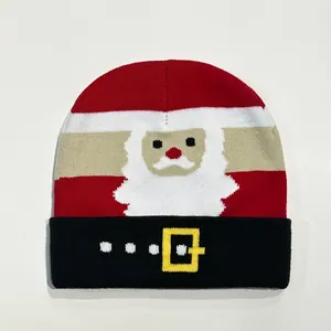 Macro detail of Christmas knit beanie with striped pattern and Santa Claus graphic