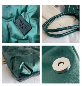 Detail view of green quilted tote bag showing magnetic closure and fashion logo patch