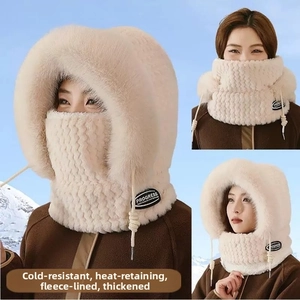 Detail of faux fur winter bucket hat with neck warmer and drawstring in beige