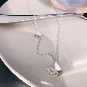 Double-layered butterfly pendant necklace in titanium steel with a frosted silver finish