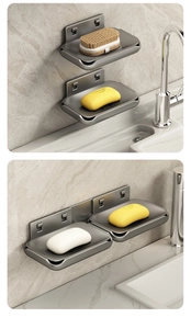 Detail of gunmetal grey wall-mounted soap dish with drainage and adhesive installation