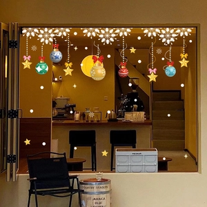 Christmas window stickers with colorful ornaments, snowflakes and stars on shop glass
