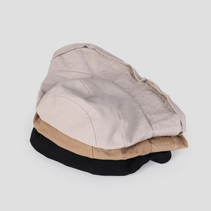 Breathable washed cotton fisherman hats in cream, khaki and black stacked together