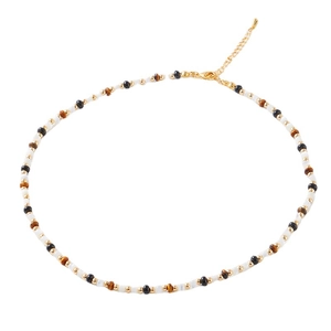 Vintage beaded choker with tiger eye, onyx, and white beads on a clean white backdrop