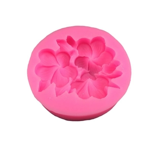 Pink round silicone mold featuring detailed gardenia flower patterns for fondant and resin