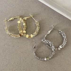 Minimalist geometric C-shaped hoop earrings with gold and silver textured bead accents