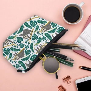 Cute sloth and tropical leaf print makeup bag for travel, showcasing its large capacity