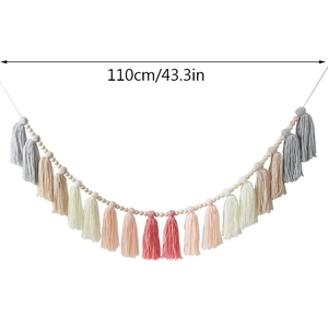 Bohemian style wood bead garland with colorful cotton tassels measuring 110cm in length