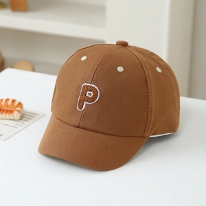 Detailed close-up of dark brown cotton baseball cap with white floral and P letter embroidery
