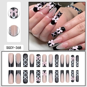 French black press-on nails with 3D pink bows, white pearls and cross ribbon patterns