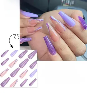 Detailed view of long ballerina press on nails in purple glitter and artistic swirl patterns