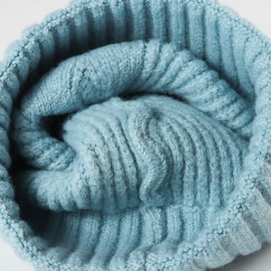Thick light blue ribbed knit beanie for women showing warm textured wool fabric details