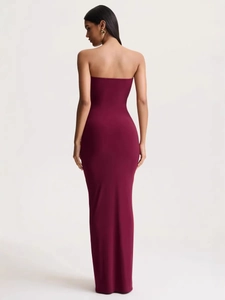 Elegant backless burgundy tube dress with ruched design and slim fit maxi silhouette