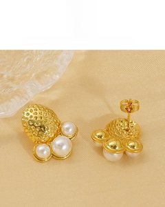 Detail of 18K gold plated cluster earrings featuring four pearls in a floral claw design