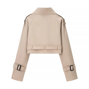 Back view of a khaki cropped trench coat jacket with epaulettes and waist belt details
