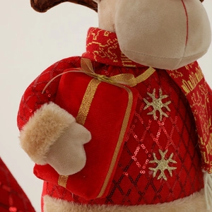 Christmas plush gnome in red and gold sequins holding a gift box holiday ornament