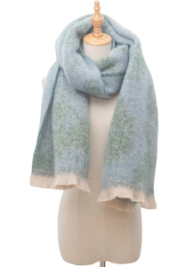 Detail of light blue and green jacquard scarf with soft beige fringe tassels
