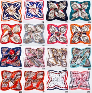Collage of 16 different patterns of 50x50cm square satin silk scarves with SKU numbers